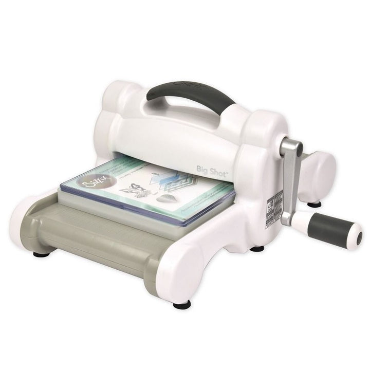 Big Shot Sizzix Prägemaschine mit Kurbel zum manuellen Schneiden und Prägen von Papier.