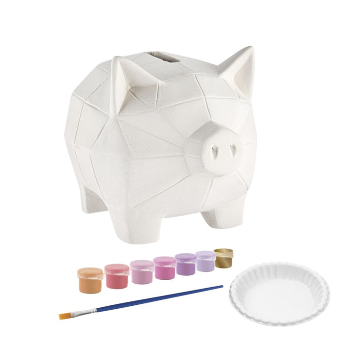 Detailansicht der 7 Farben, des Pinsels und der Mischpalette aus dem ARTMIE Sparschwein-Malset.