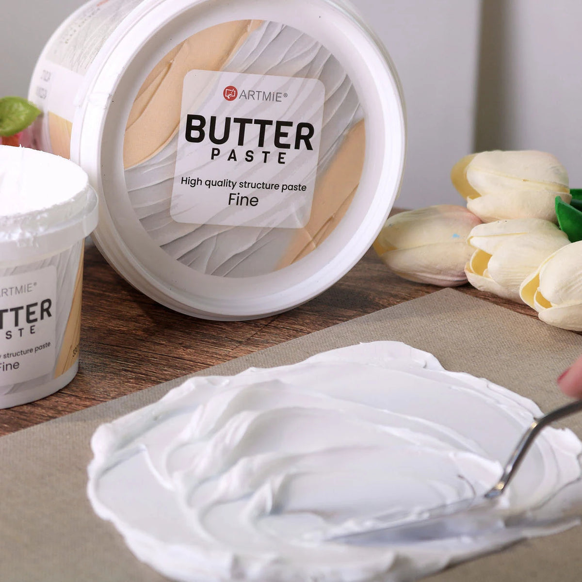 Eimer der ARTMIE Butter Fine Paste, Nahaufnahme von Verpackung und Deckel
